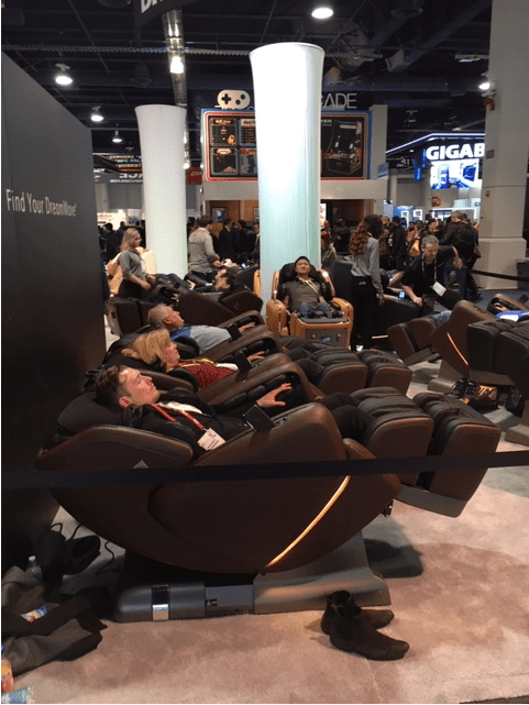 CES attendees in massage pods